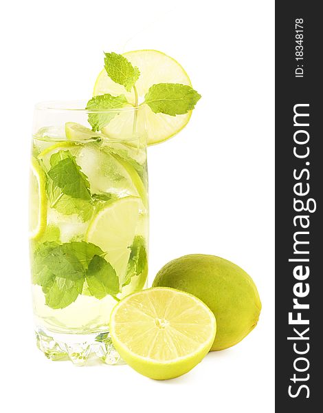 Mojito cocktail with lime, mint leaves and ice on white background. Mojito cocktail with lime, mint leaves and ice on white background