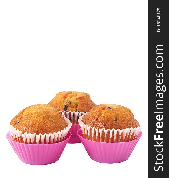 Fresh blueberry muffins in pink cups isolated on white background. Fresh blueberry muffins in pink cups isolated on white background