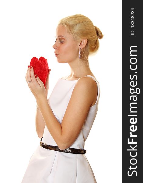 Young attractive elegant woman holding a big red heart. Isolated on a white background. Young attractive elegant woman holding a big red heart. Isolated on a white background