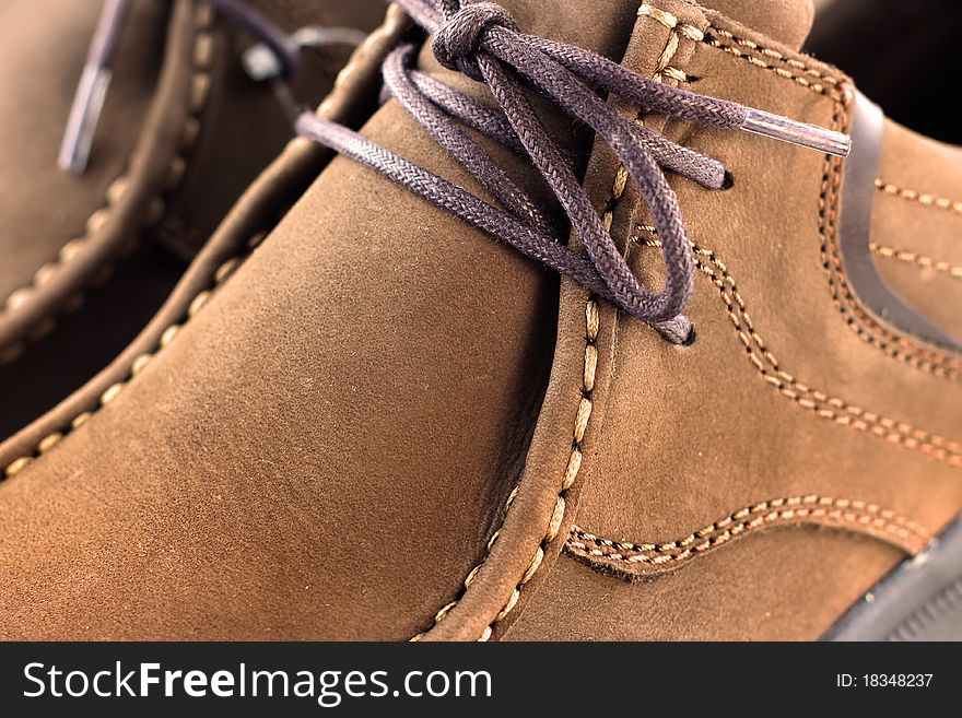 Close up shot of brown shoe leather. Close up shot of brown shoe leather