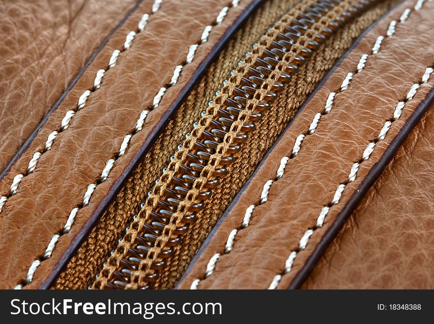 Close up shot of brown leather zipper