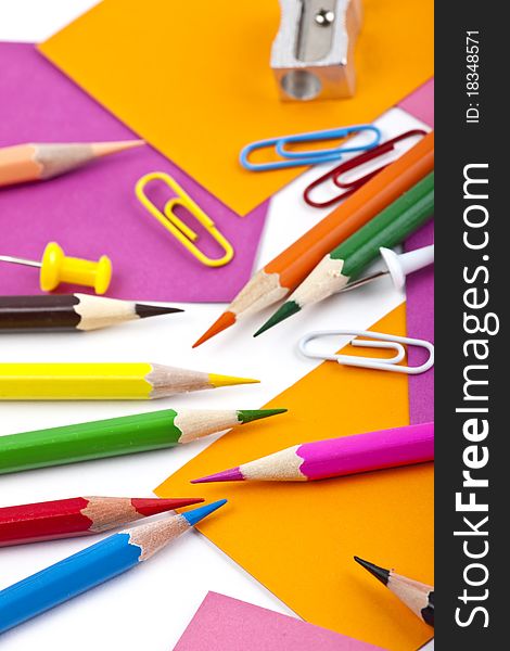 Office and student tool with colorful pencils over white background