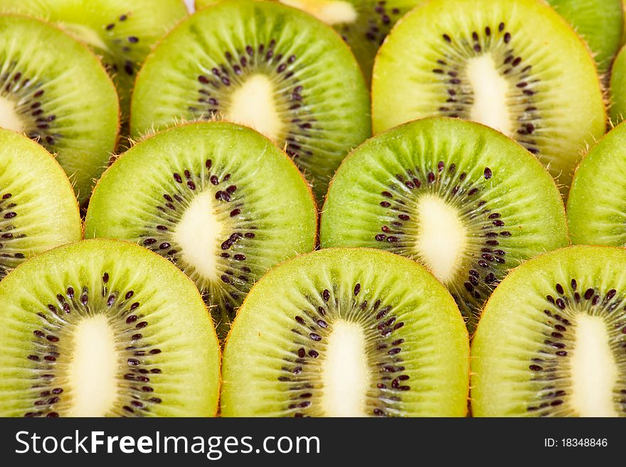 Lots of fresh kiwi as a background