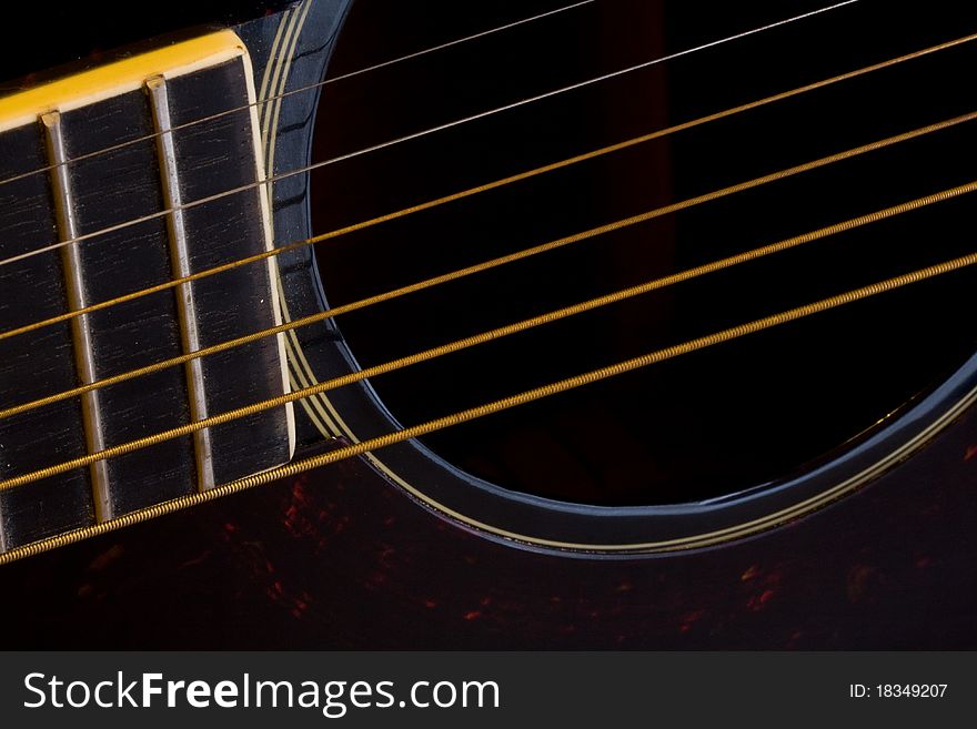 Close-up of strings of a folk guitar