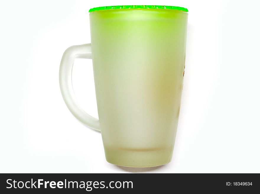 Glass of water on a white background with a green cap