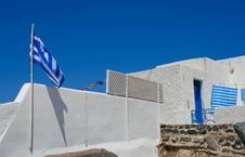 White Old Street In Santorini With Greece Flag Stock Photography