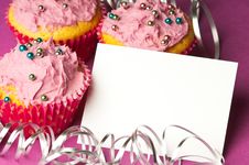 Cupcakes With A Blank Invitation Royalty Free Stock Photography