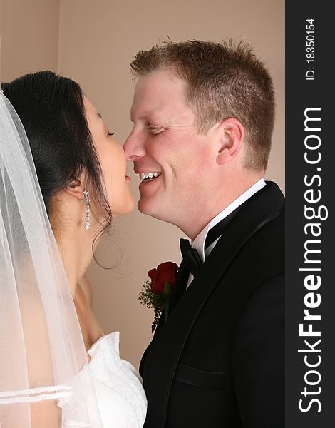 Bridal couple with their faces close together