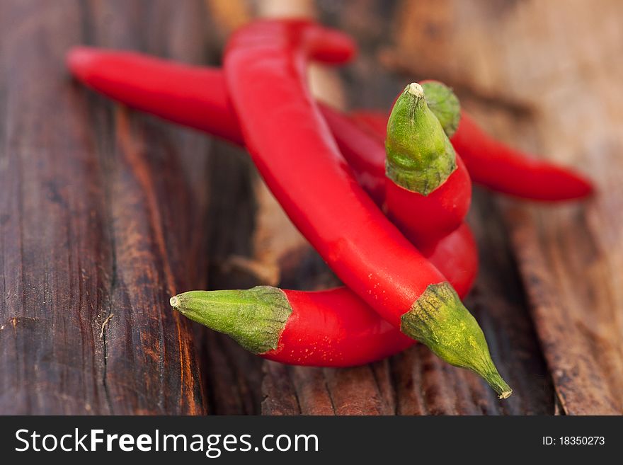 Red peppers on leaves of a banana plant