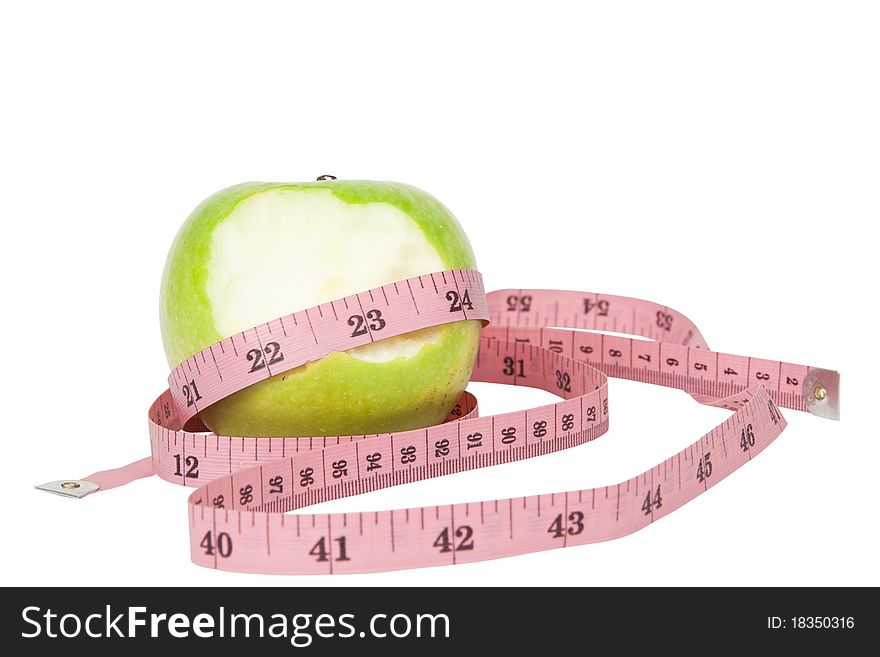 Green apple and tape isolated on white background