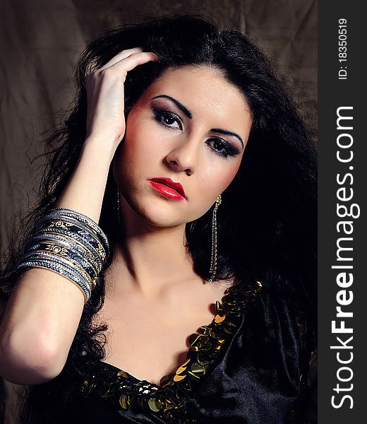 Beautiful model woman with long black healthy hair in arabic traditional clothes. Beautiful model woman with long black healthy hair in arabic traditional clothes