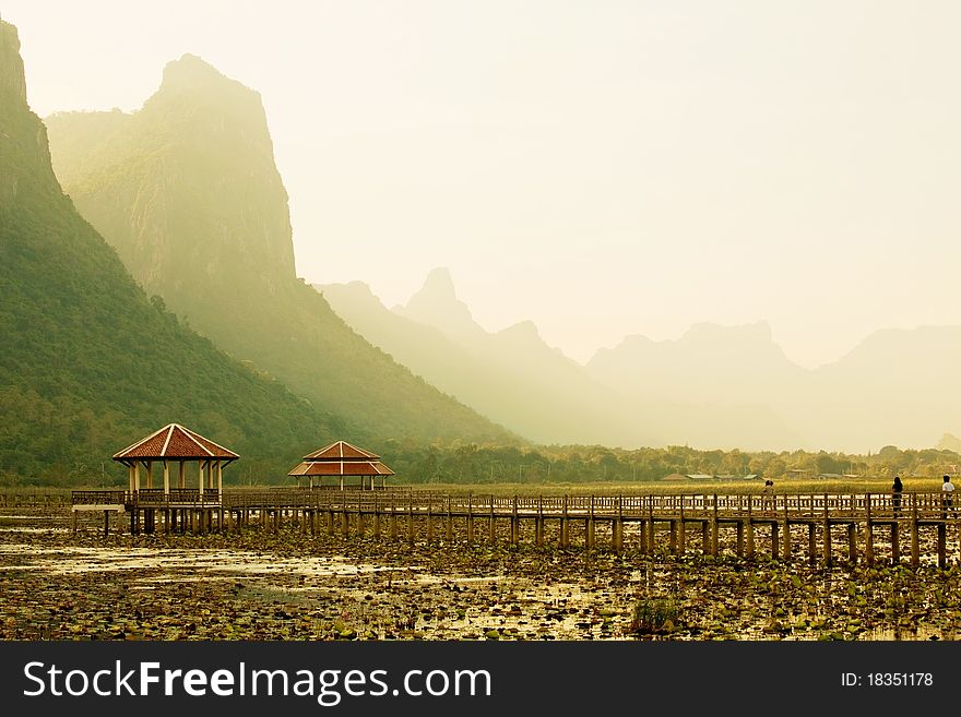 Footbridge in lake into the mountain, thailand