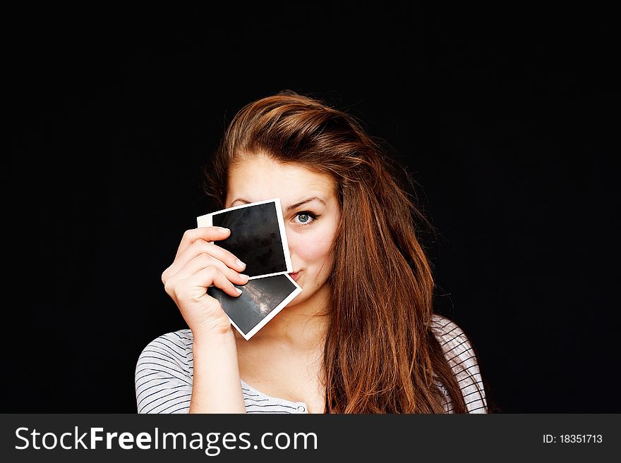 Girl on a black background with photos. Girl on a black background with photos