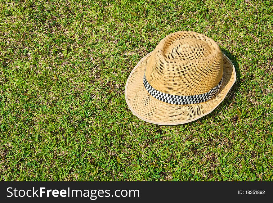 Hat on the green lawn. Hat on the green lawn