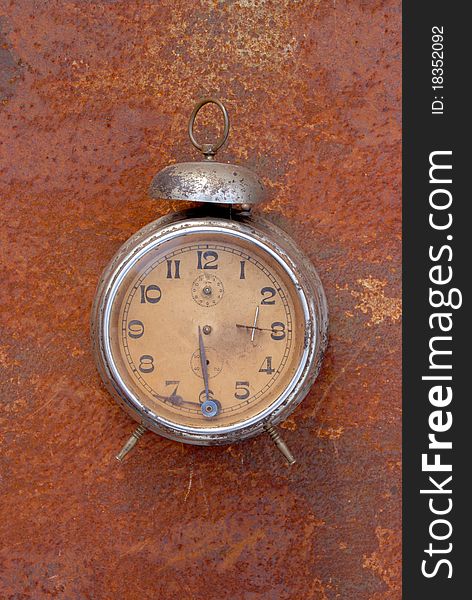 Vintage clock on rusting bacground. Vintage clock on rusting bacground