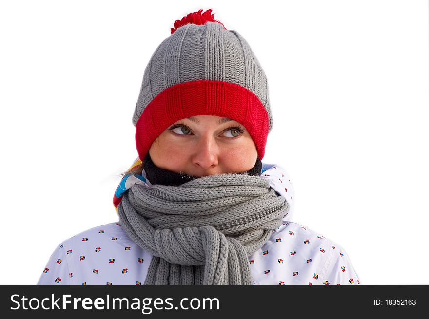 Attractive woman wrapped in a gray scarf is looking up. On a white background. Winter.