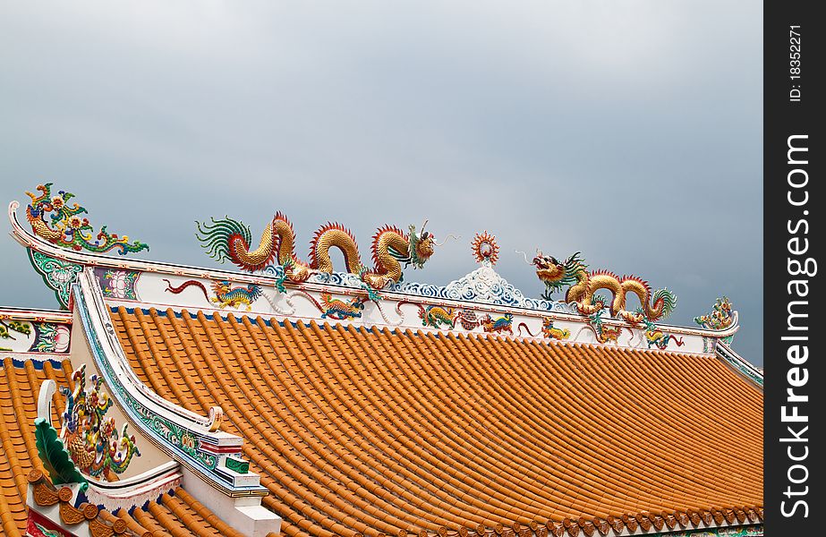 Dragon sculpture on roof of chinese shrine,East of Thailand