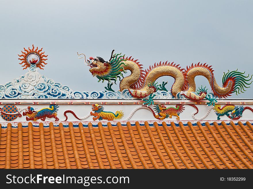 Dragon sculpture on roof of chinese shrine,East of Thailand