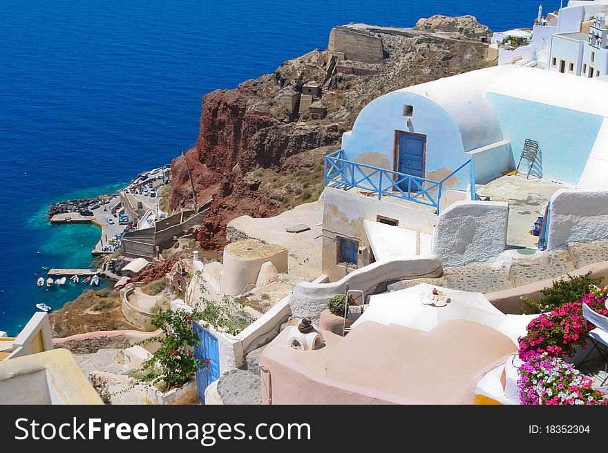 Beautiful street and traditional white and blue architecture on island of Santorini in Fira, Greece. Beautiful street and traditional white and blue architecture on island of Santorini in Fira, Greece.