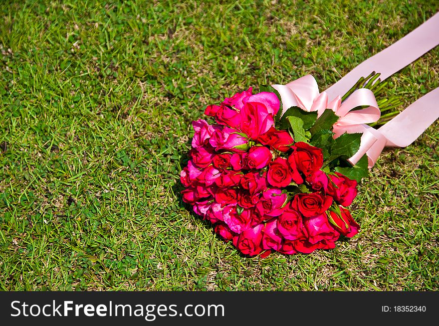 Bouquet of rose on the green lawn. Bouquet of rose on the green lawn