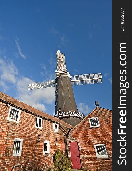 Traditional working windmill at a granary in the countryside