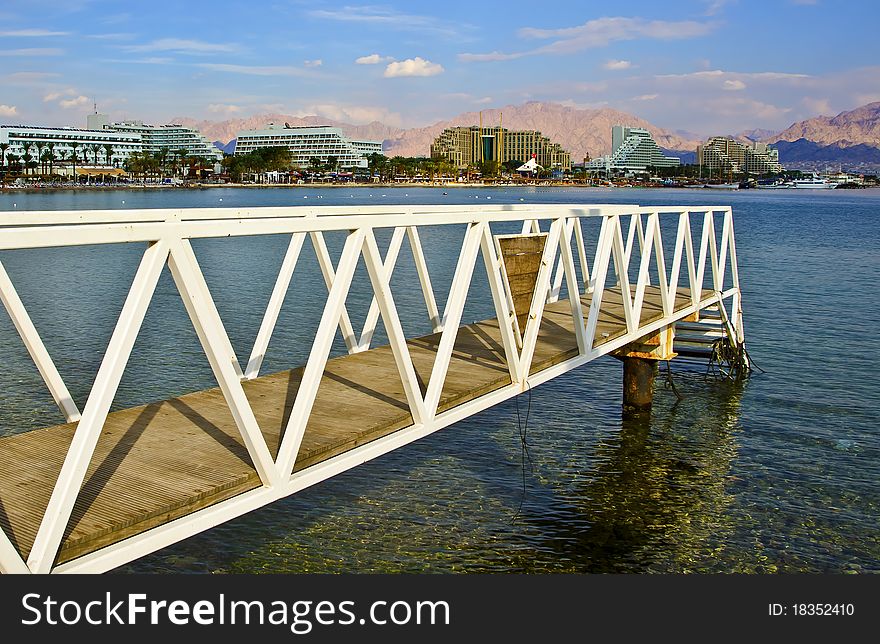 This shot was taken from the northern beach of Eilat city - famous resort and recreation center of Israel. This shot was taken from the northern beach of Eilat city - famous resort and recreation center of Israel