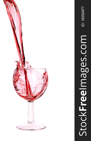 Studio photo of pouring red wine into glass.Isolated on white background. Studio photo of pouring red wine into glass.Isolated on white background