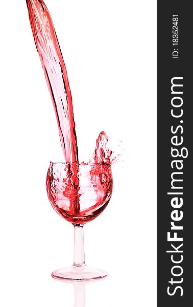 Studio photo of pouring red wine into glass.Isolated on white background. Studio photo of pouring red wine into glass.Isolated on white background