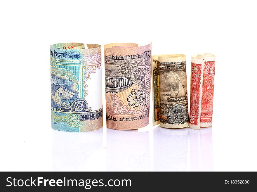 Rolled indian  rupees notes over white background. Rolled indian  rupees notes over white background.