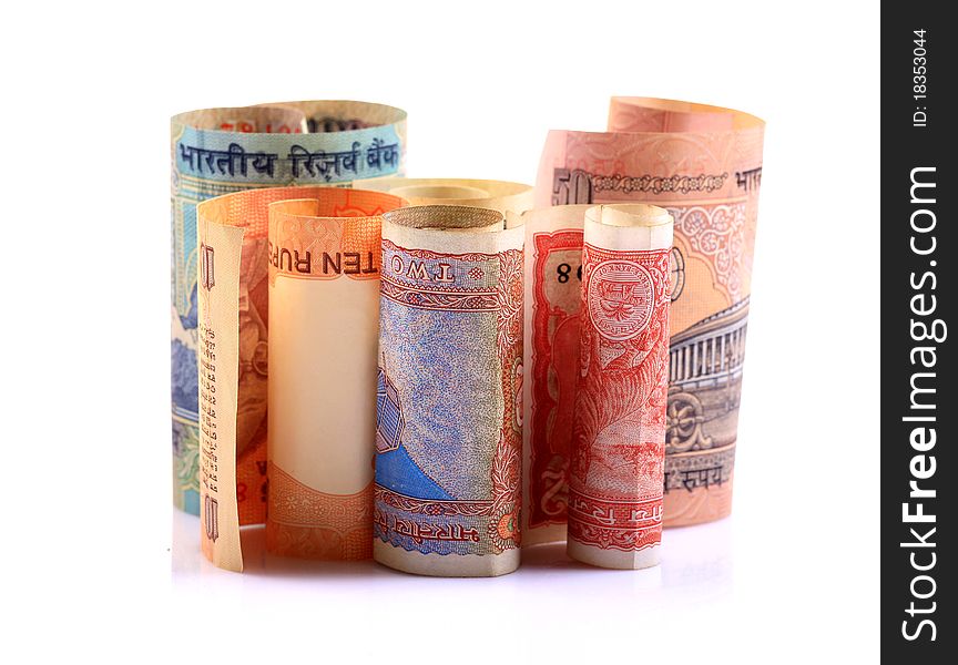 Rolled indian  rupees notes over white background. Rolled indian  rupees notes over white background.