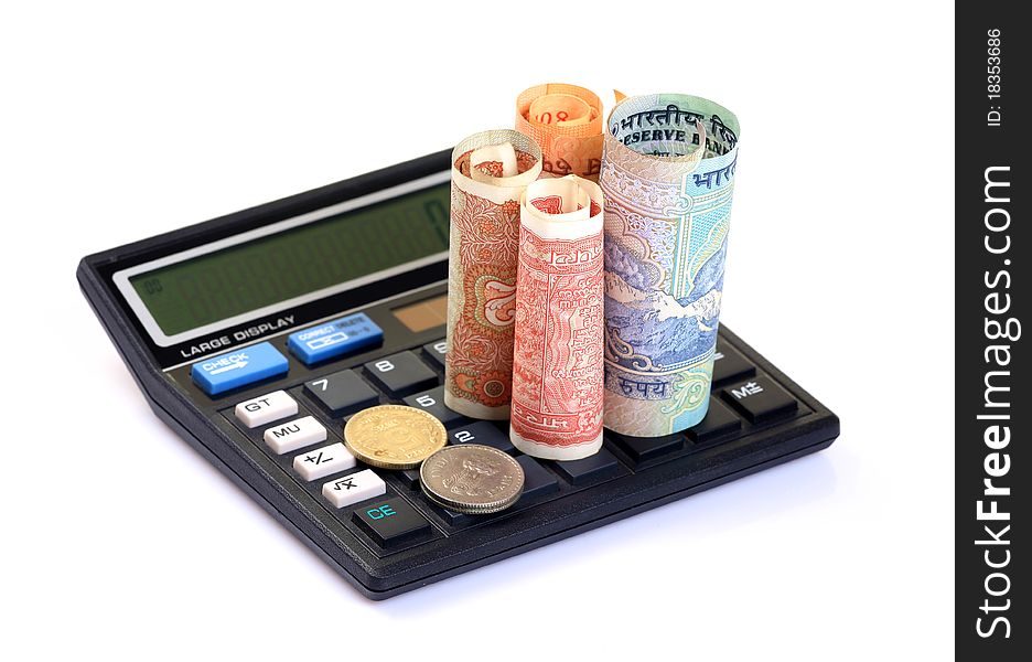 Currency notes and coins with calculator over white isolated background. Currency notes and coins with calculator over white isolated background.