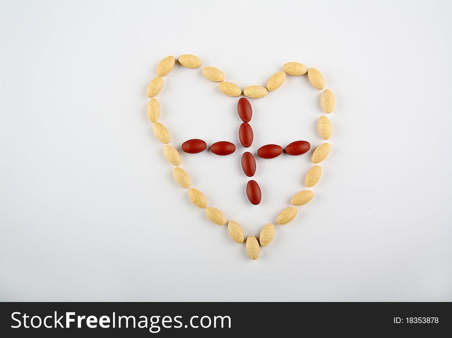 Pill heart with red cross