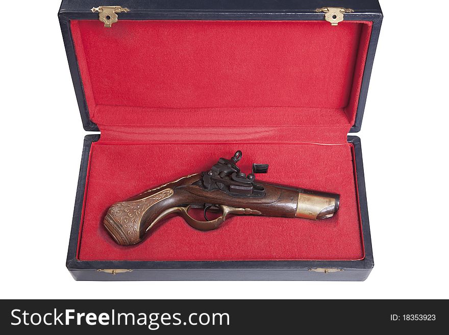 Old black powder gun in its red case
