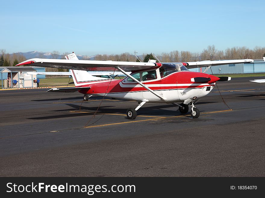 Small single engine aircraft parked at the Troutdale airport near Portland Oregon. Small single engine aircraft parked at the Troutdale airport near Portland Oregon.