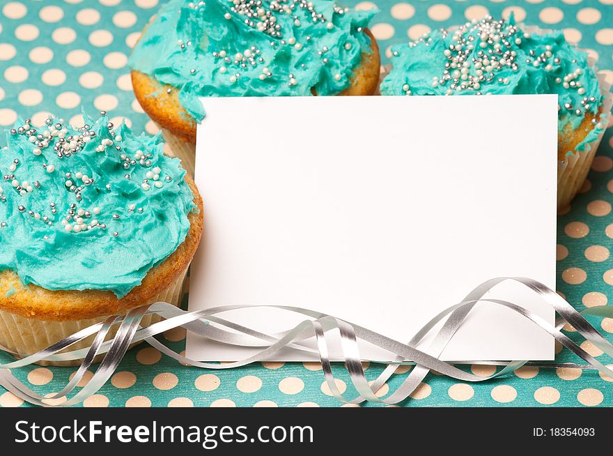 Cupcakes with a blank paper to write your own message. Cupcakes with a blank paper to write your own message
