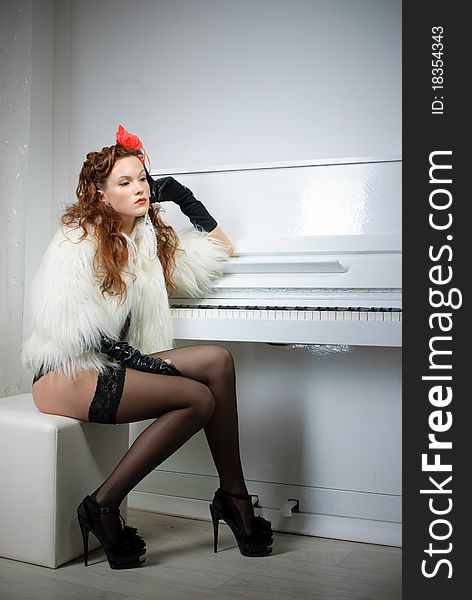 Sexy Woman Near White Piano