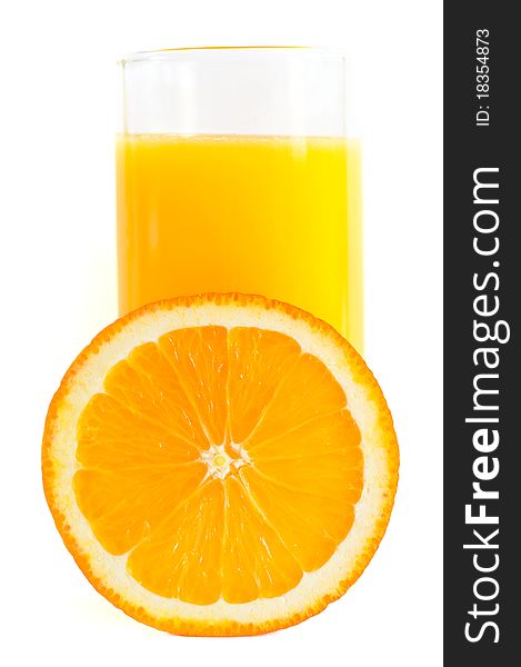 Half an orange and a glass of juice. White background. Half an orange and a glass of juice. White background.