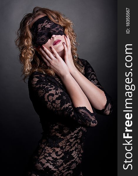 Beautiful woman with lace mask