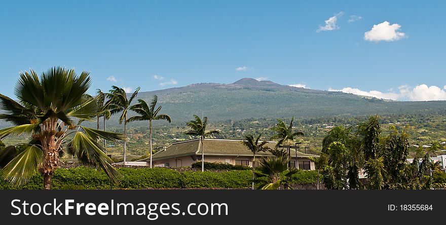 Usually under cloud cover and vog (volcanic smog), the top of Kona's Hualalai Volcano enjoys some sunshine. Usually under cloud cover and vog (volcanic smog), the top of Kona's Hualalai Volcano enjoys some sunshine.