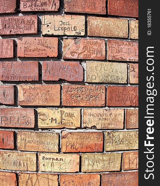 Image of bricks with messages on the round wall