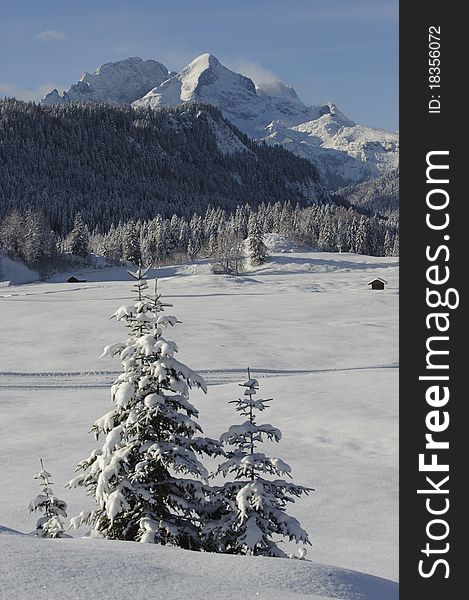 Winter landscape with snow at alp mountains in upper bavaria, germany