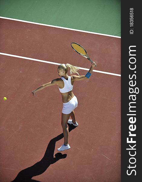 Young Woman Play Tennis Outdoor