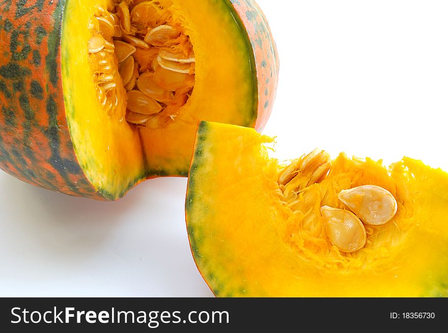 Freshly cut pumpkin on white background