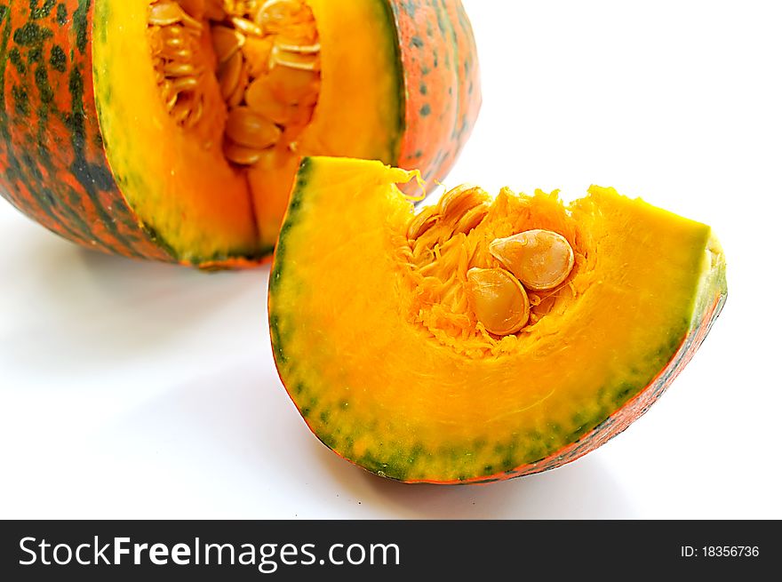 Freshly cut pumpkin on white background