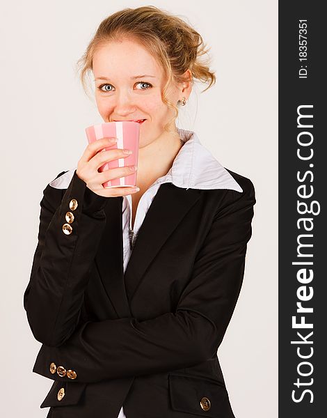 Business woman with cup of tea on a white background. Business woman with cup of tea on a white background