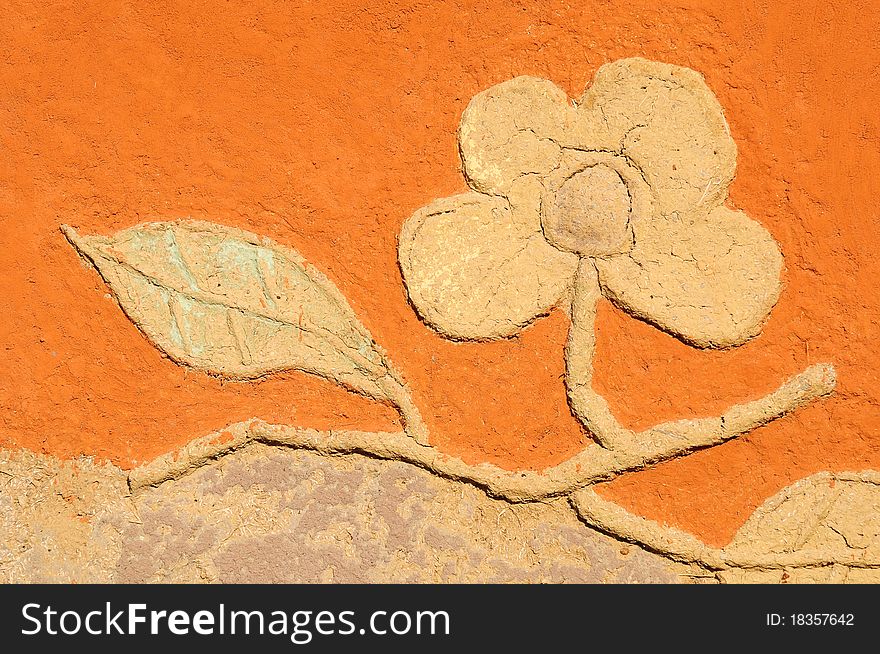 Flowers made from clay at the wall