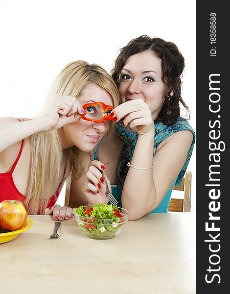 Girlfriends cheerfully play with food
