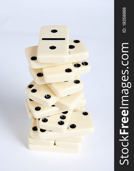 Domino cubes pile on white background