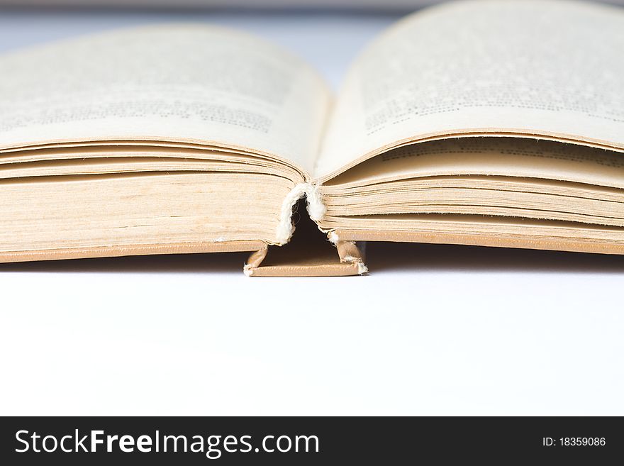 Hardcover book on white table. Hardcover book on white table