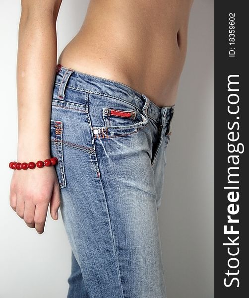 Woman in old blue jeans and stomach. Woman in old blue jeans and stomach
